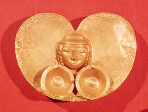 Pectoral with a human face wearing earrings, from Restrepo, Cauca Valley, Calima Period by Pre Columbian